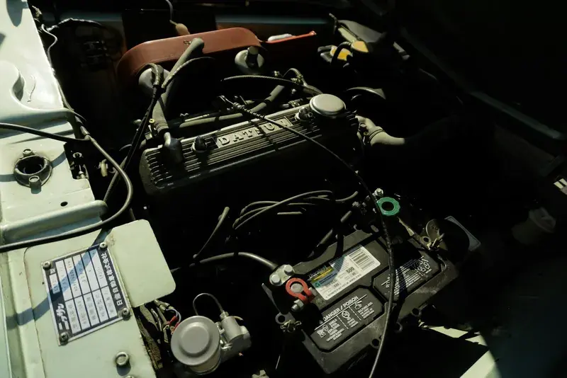 Close-up of a car engine and battery